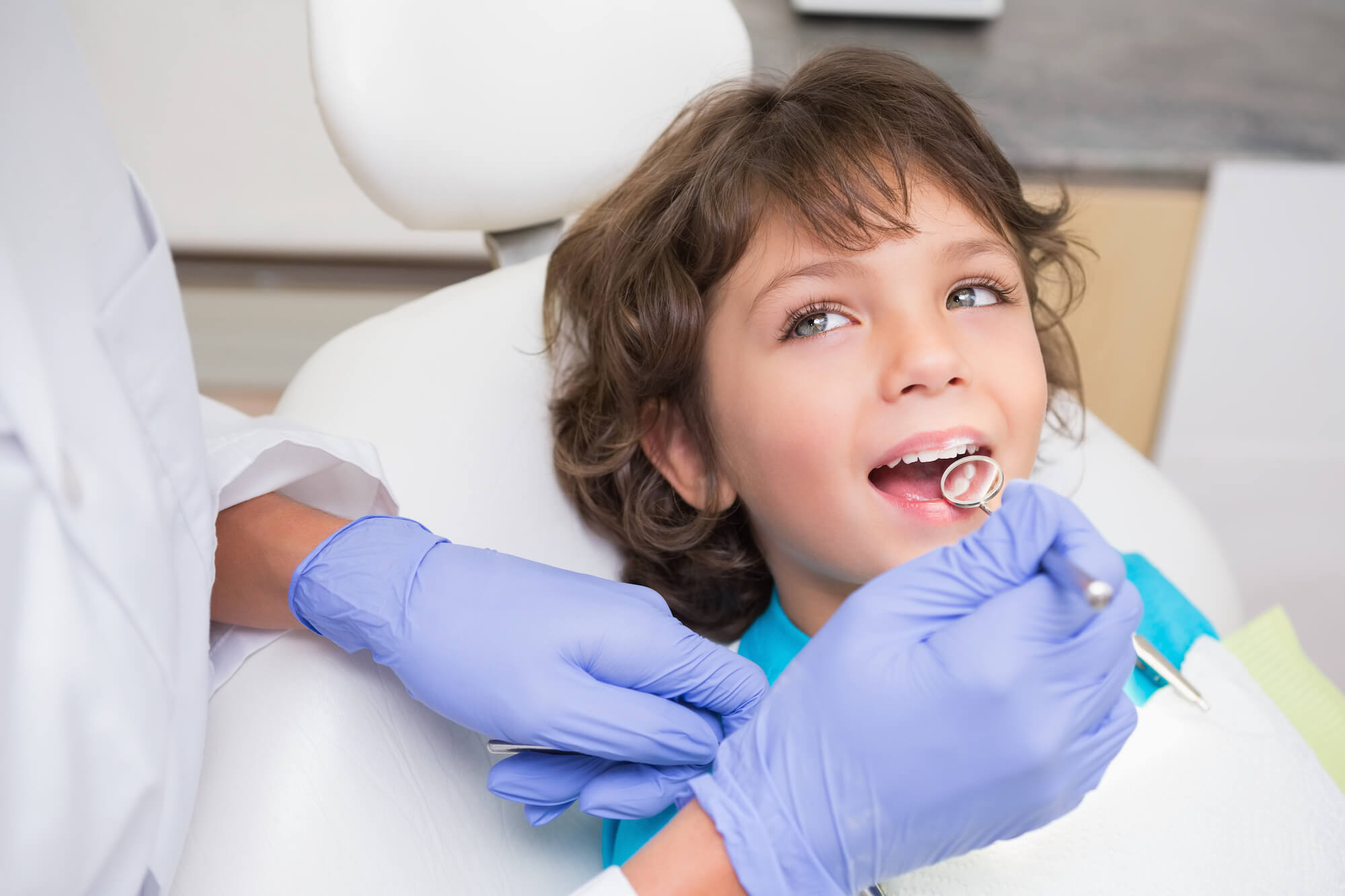 Pediatric Dentist Examining little boy at Bite Size Smiles Pediatric Dentistry