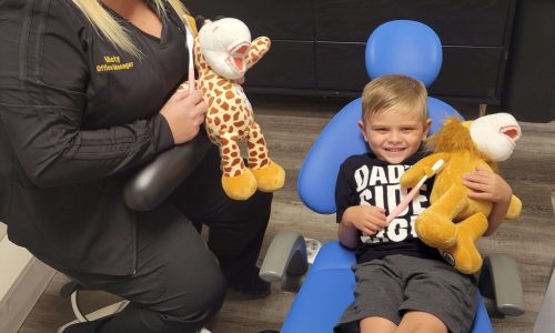 Bite Size Smiles Pediatric Dentistry dentist chair with happy child