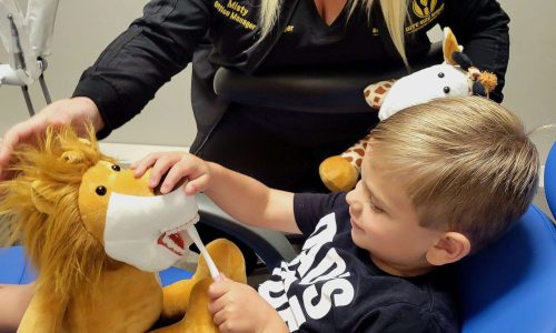 Teaching kids how to brush their teeth at Bite Size Smiles Pediatric Dentistry