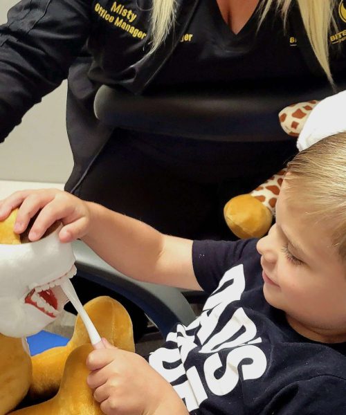 Teaching kids how to brush their teeth at Bite Size Smiles Pediatric Dentistry